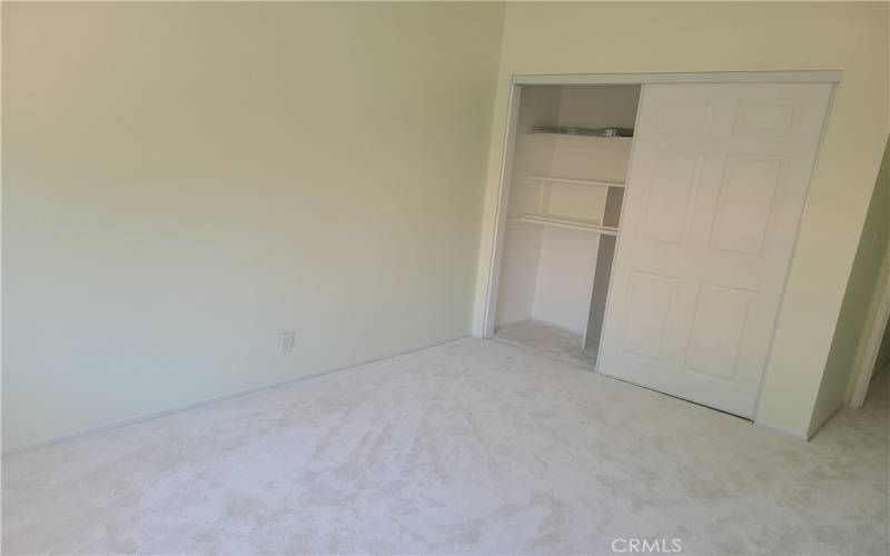 second bedroom with closet shelving