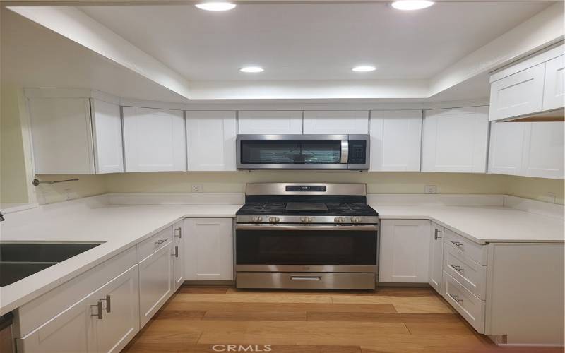 New upper cabinets, canned lighting and stainless Microwave !