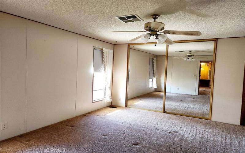 Master bedroom with mirrored closets