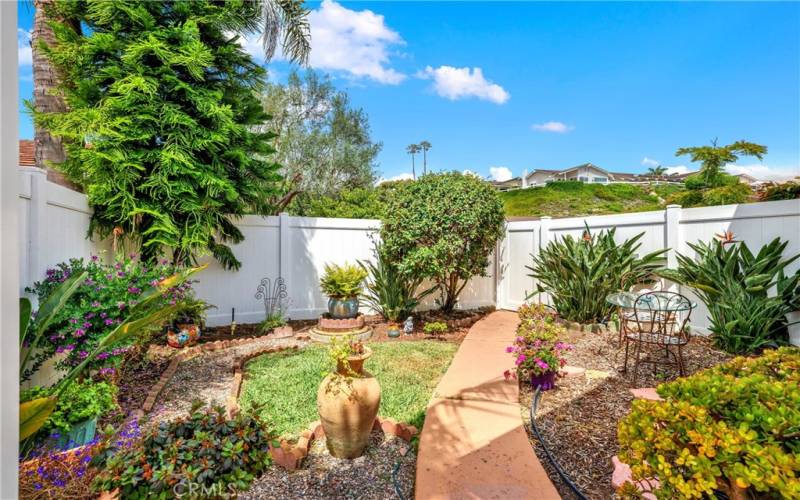 Pathway through the garden leads to rear gate onto the parking area.