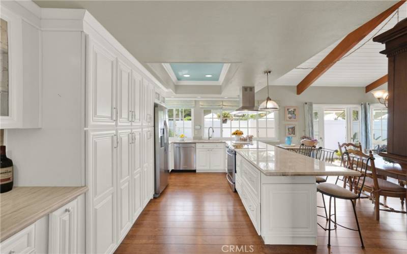 Beautifully upgraded kitchen with custom cabinets include pull-outs, high end appliances and storage drawers.