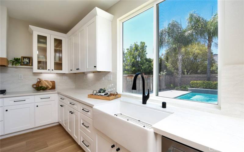 Kitchen sink is a deep basin, apron sink overlooking the pool!