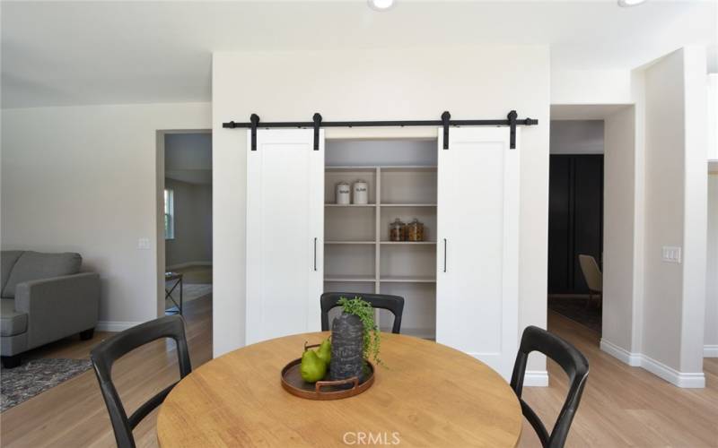 Large, walk in pantry with dual barn doors.