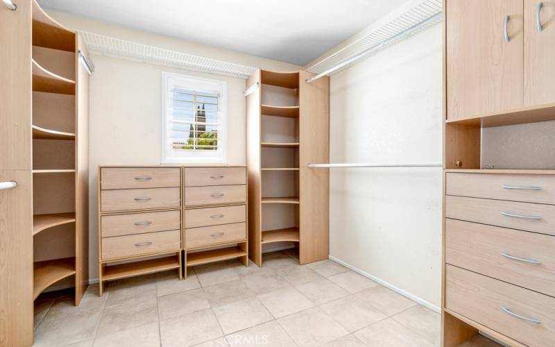 Master bedroom has a walk in closet with custom organizer