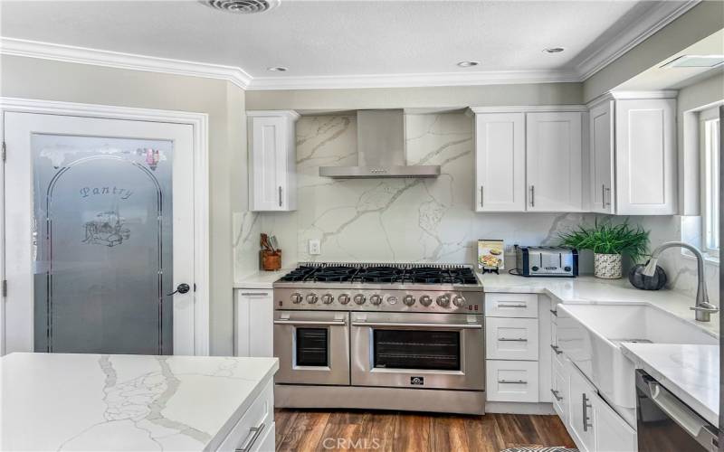 Gourmet kitchen with double ovens and professional gas stove.

Plenty of space in your walk in pantry.