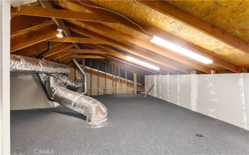 Large semi-finished storage area accessed from loft.