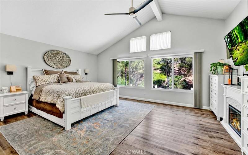 2nd Level Spacious Main Bedroom Suite with a view of trees and hillside