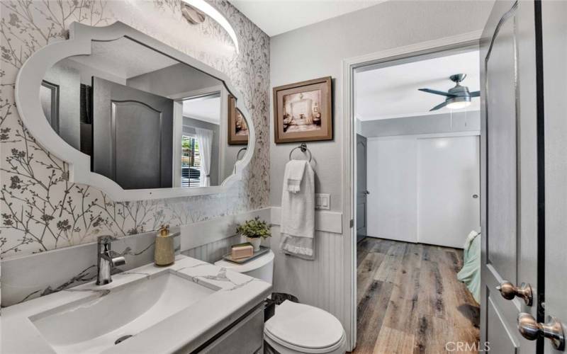 Main level guest bathroom with a shower