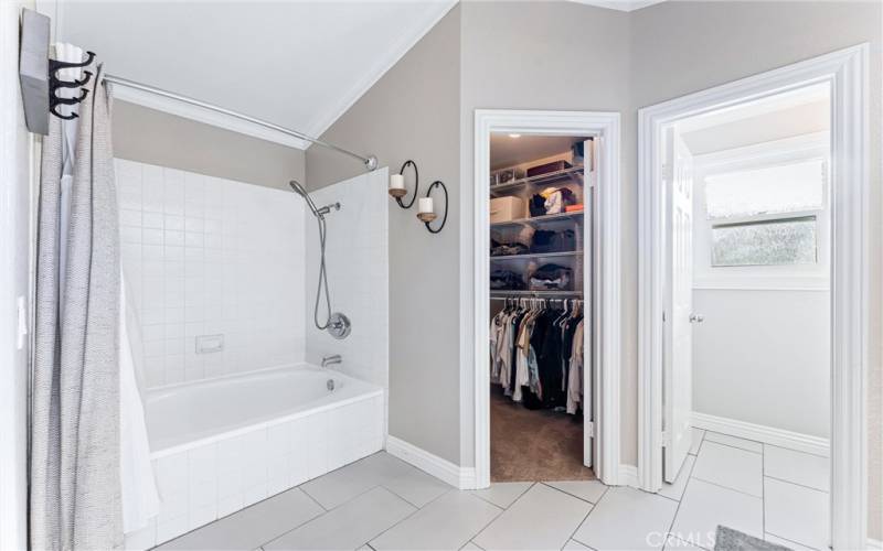 Shower/Tub near walk-in closet and dual sinks