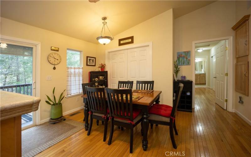 Kitchen nook for cozy meals overlooking the pines. Entrance to the deck is also found.