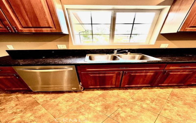 Open Kitchen with Stainless Steel Appliances.