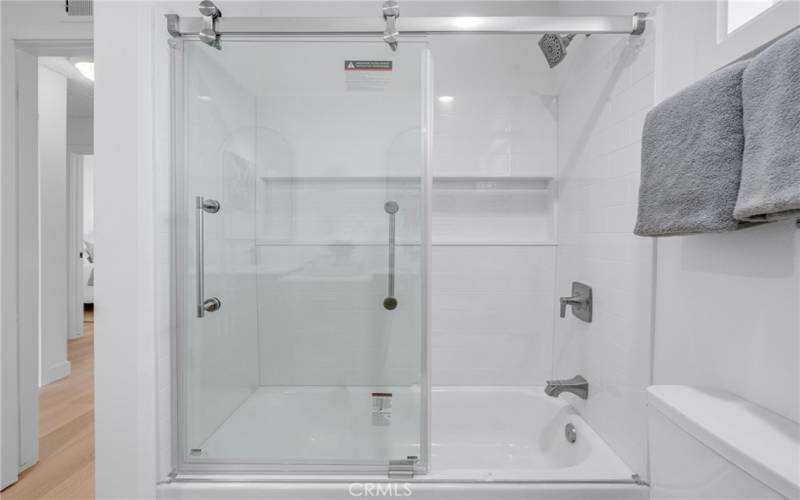 Upstairs central bathroom with complete new shower/tub with glass encloser.