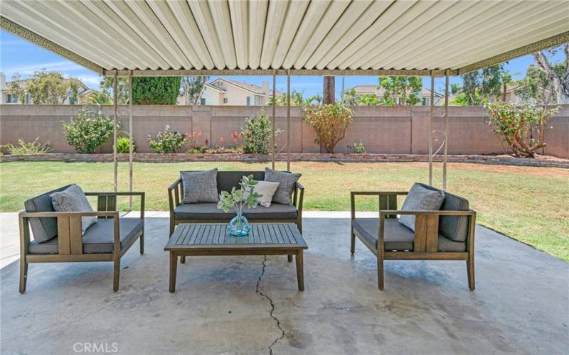 Extra-large cement covered patio in backyard