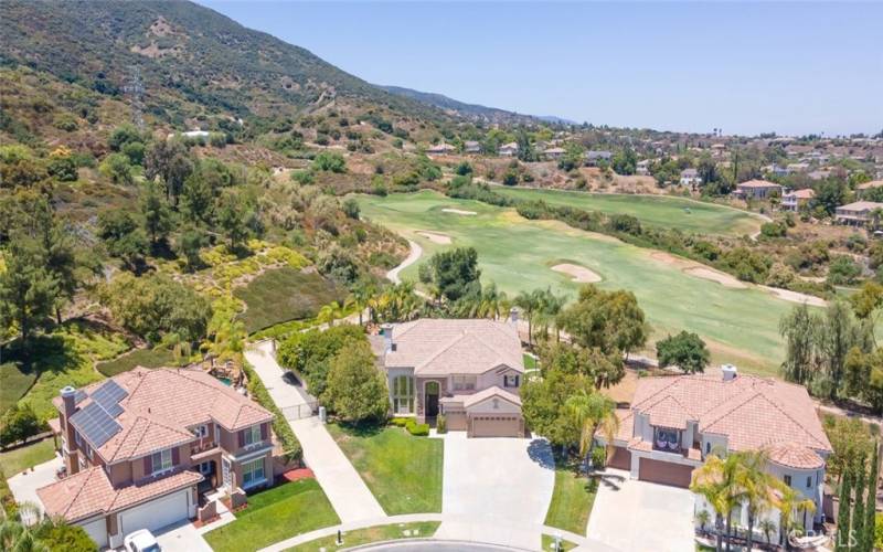 Beautifully located home adjacent to a pristine golf course, surrounded by rolling hills.