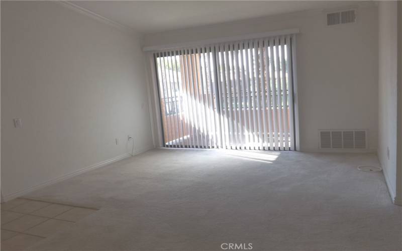 Living room has vaulted ceiling.