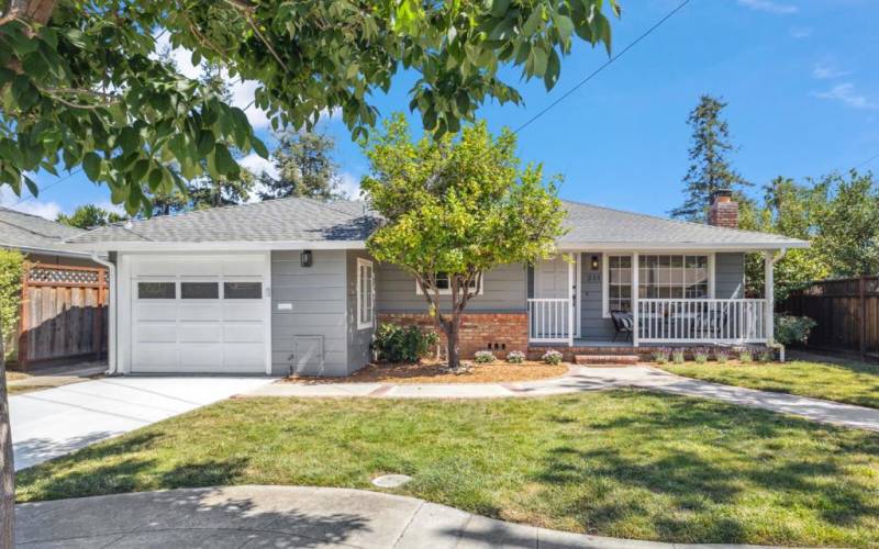 Charming ranch style home on a tree-lined street.