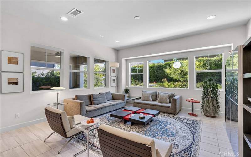 Living room surrounded by windows