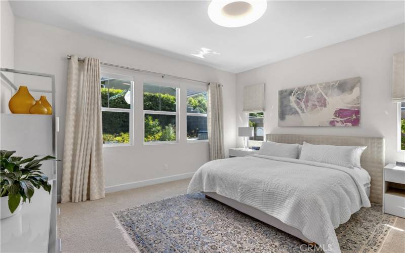 The spacious, elegant room features room-darkening curtains for privacy and relaxation.