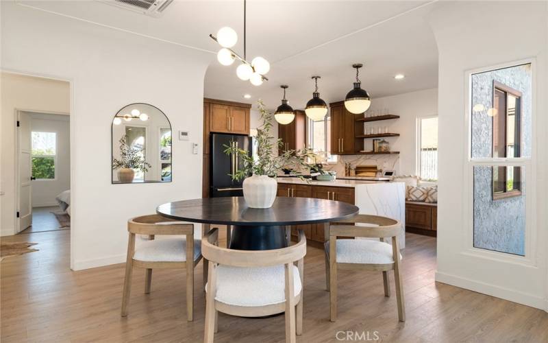 Open arched ceilings leading into the Kitchen