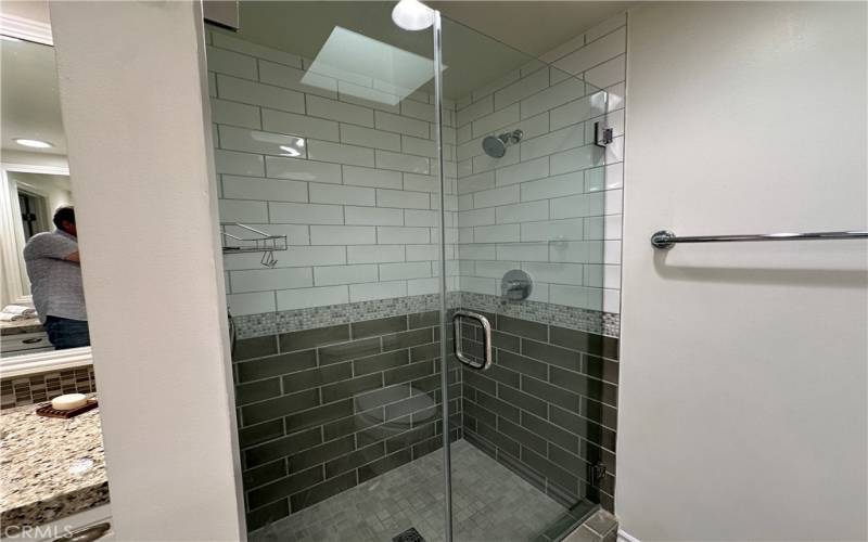 Primary bathroom shower with seamless glass