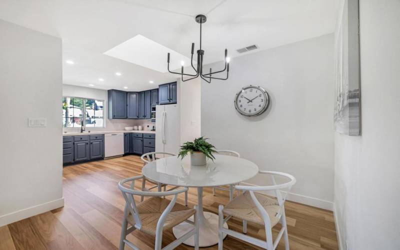 Dining area next to the kitchen with a skylite