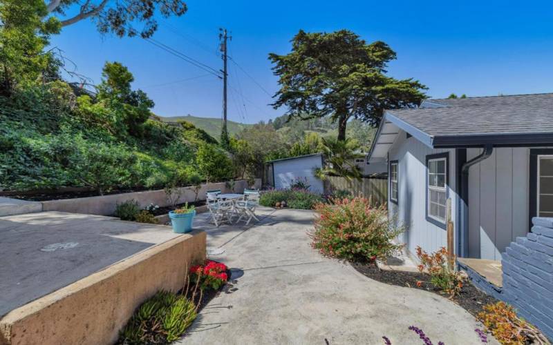 Sunny backyard patio area.  Coastal mountain views.