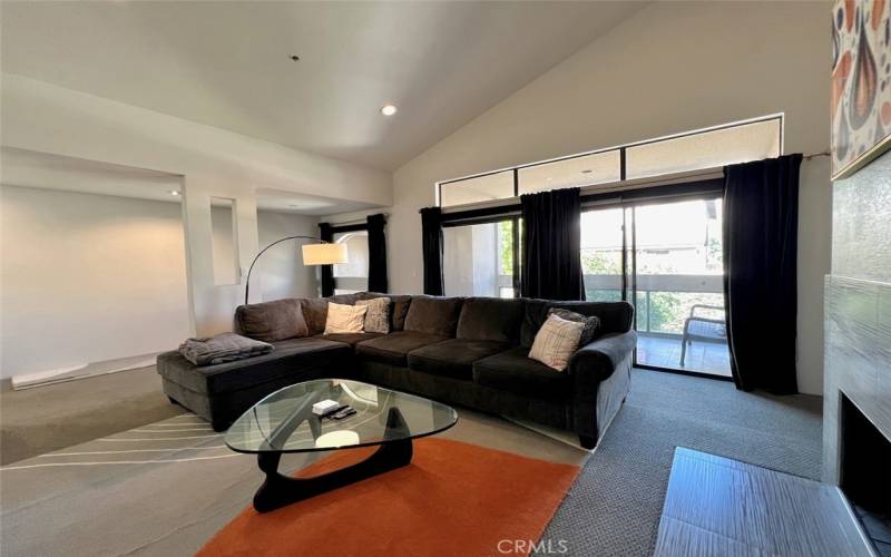 Spacious living area with private balcony and mountain views!