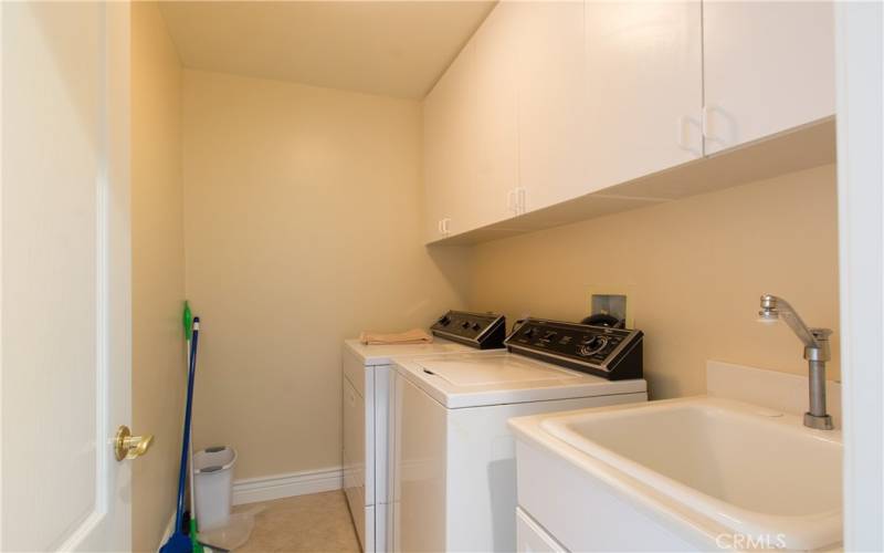 Downstairs Inside laundry with sink.  Newer washer & dryer is included.
