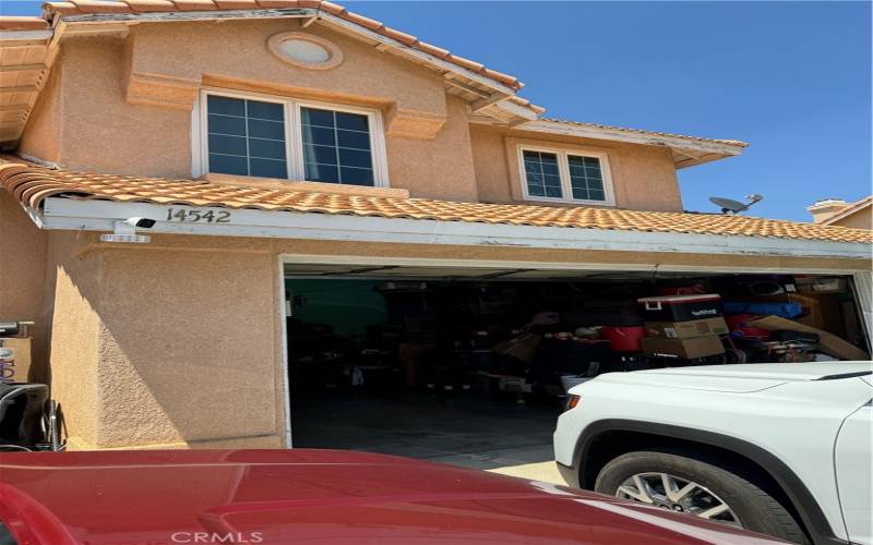 Look at this 2 car garage , and a bed room up stairs.