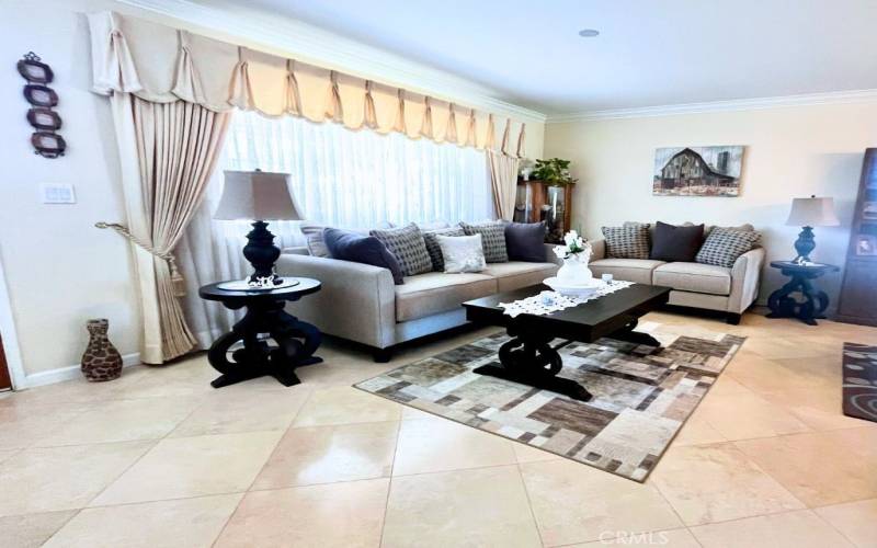 Entry Room with double pane windows, crown molding, tile floors.