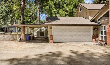 Two car garage and bonus storage shed on the left.