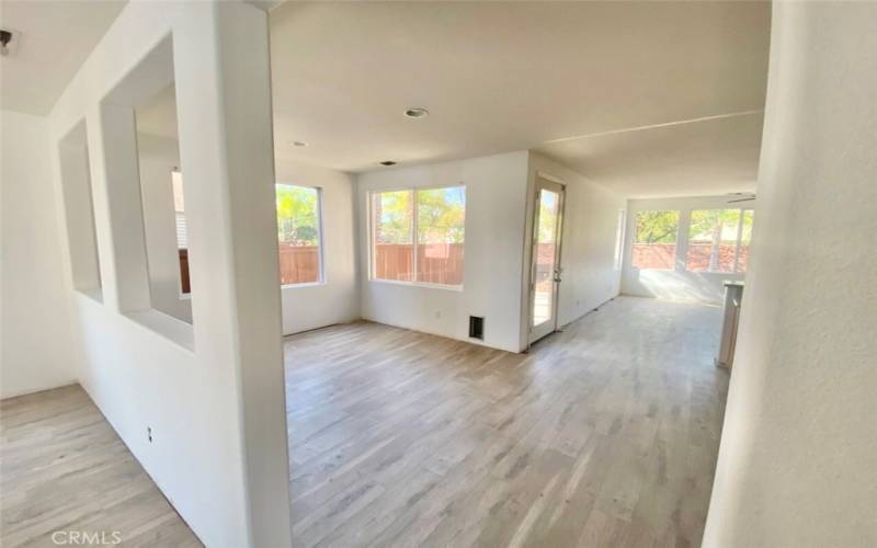 View shows kitchen nook and into family room.