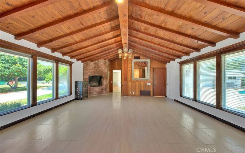 Wood beam ceiling and abundant windows