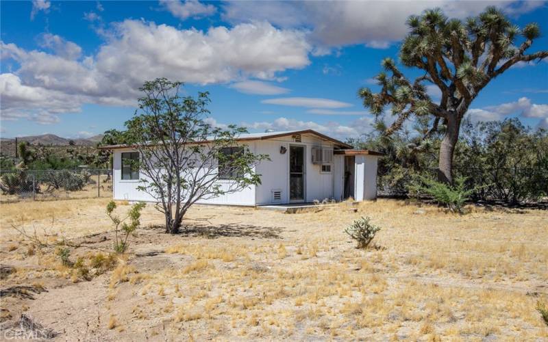 Additional structure at rear of property - bathroom in place and could serve as a bunkhouse, studio, art/yoga space, office, etc.