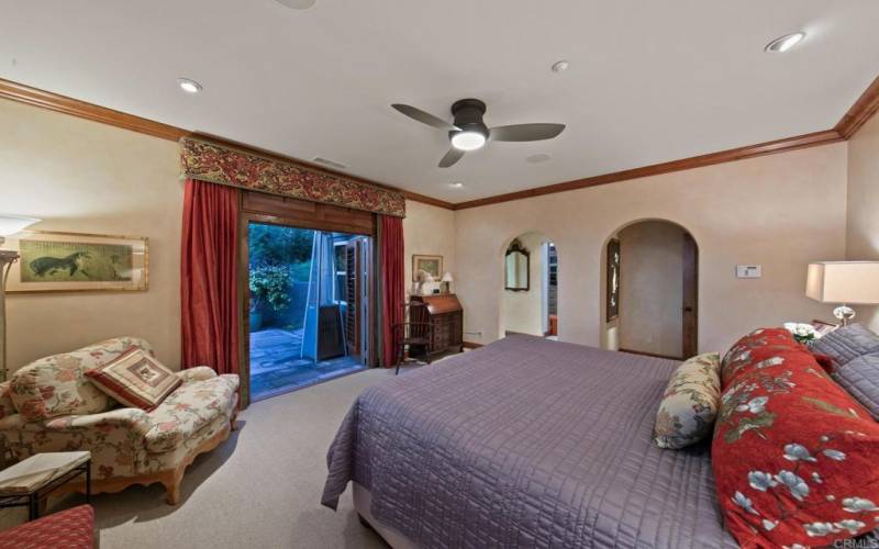 The primary suite enjoys French doors leading to a private courtyard.