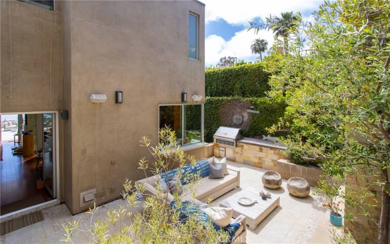 View of rear patio from upper driveway