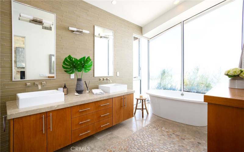 Primary Bathroom, light and bright, seperate tub, dual sinks.