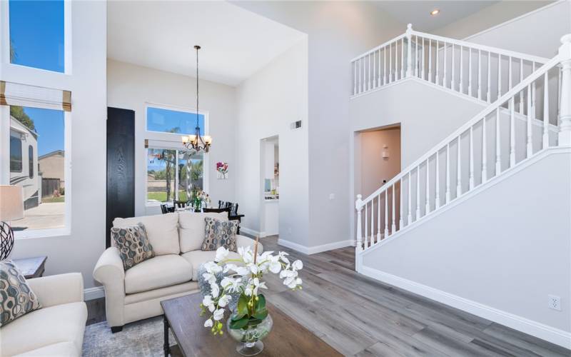 Formal living room leads to hallway and to stairs