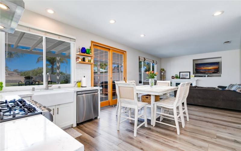 Family kitchen open to the backyard via  double sliding French door.