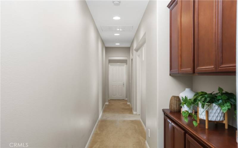 Upstairs hallway with recessed lights.