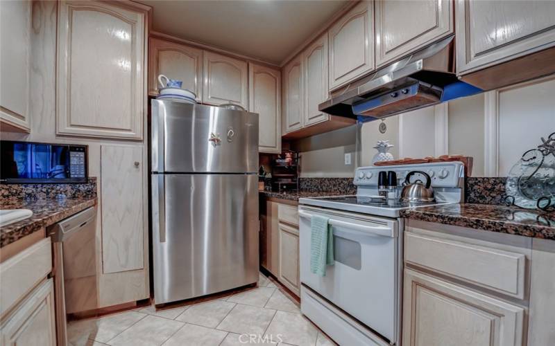 Unit is electric. Note the microwave is recessed in the wall saving valuable counter top space.