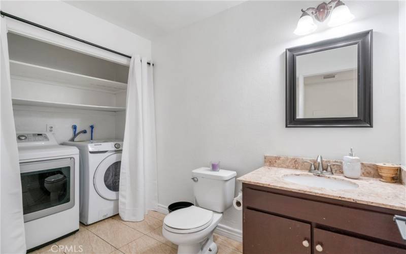 Downstairs bathroom with laundry