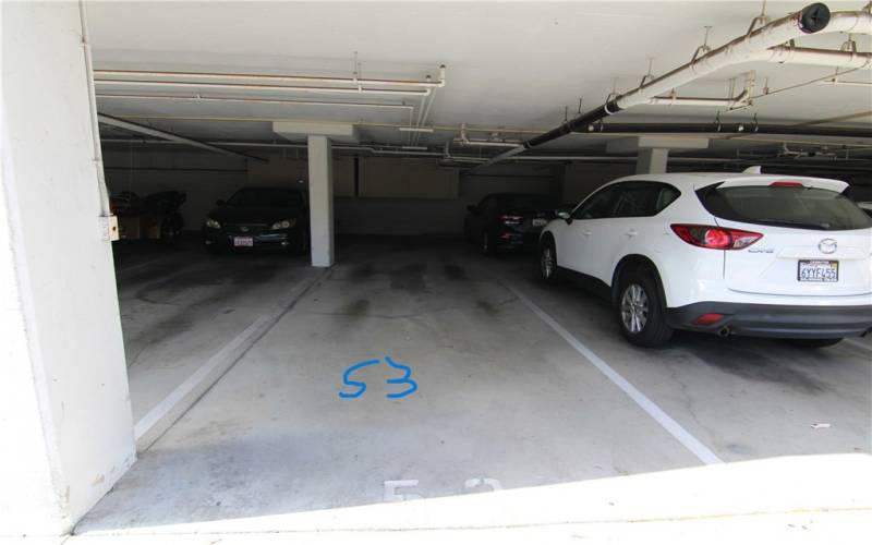 Two tandem parking spaces #53 with storage