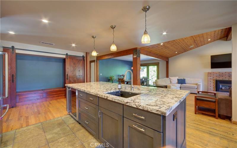 Updated kitchen looking through to dining area and living room