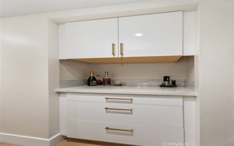 Dry Bar with great storage cabinets in hallway off of kitchen area.