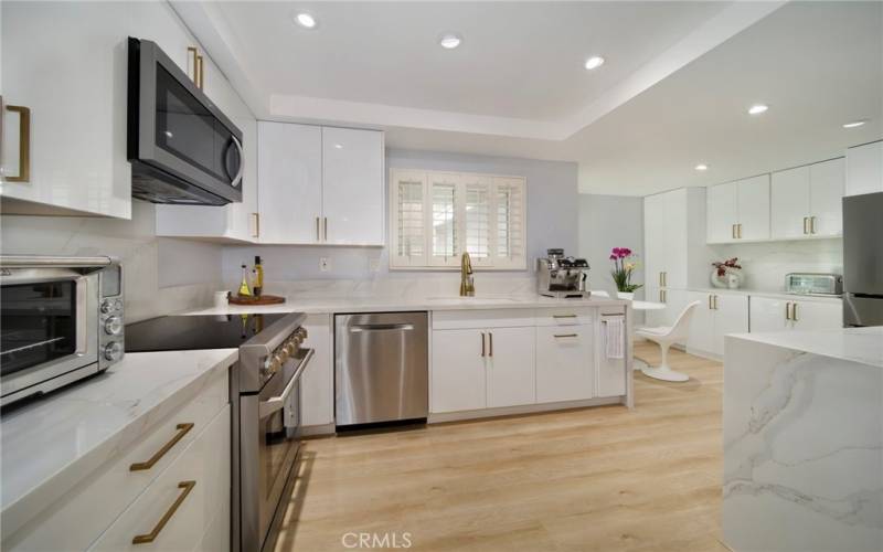 Stunning remodeled kitchen with high-end appliances and glossy lacquer cabinetry