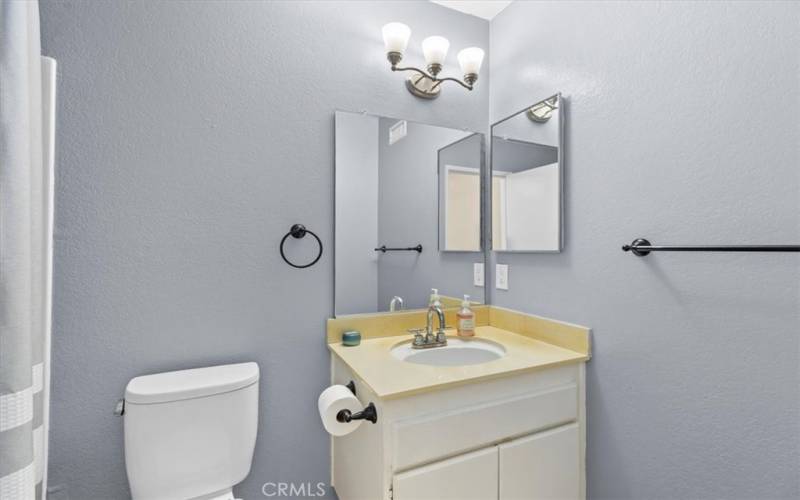 Primary bathroom with shower tub and second sink