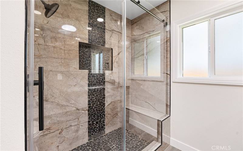 Glass Enclosed Large Shower with built-in bench and soap niche