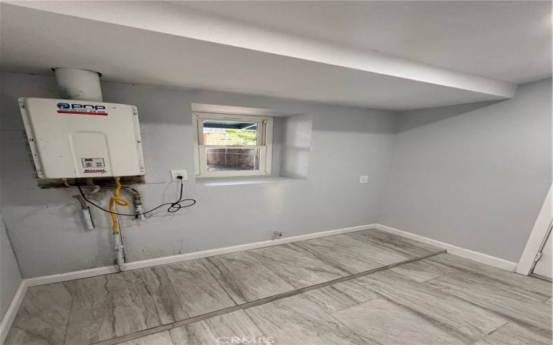 Laundry area and Electric water heater