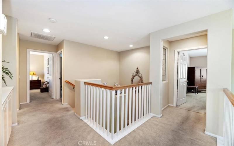 Upstairs Landing. Primary Bedroom is Separate from the Secondary Bedrooms for Maximum Privacy.